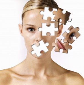 Woman with 'jigsaw-pieces' missing from face (Digital Composite)